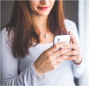 woman burying head in phone, how not to act as if