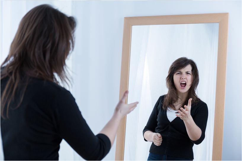 bully woman yelling at herself in mirror